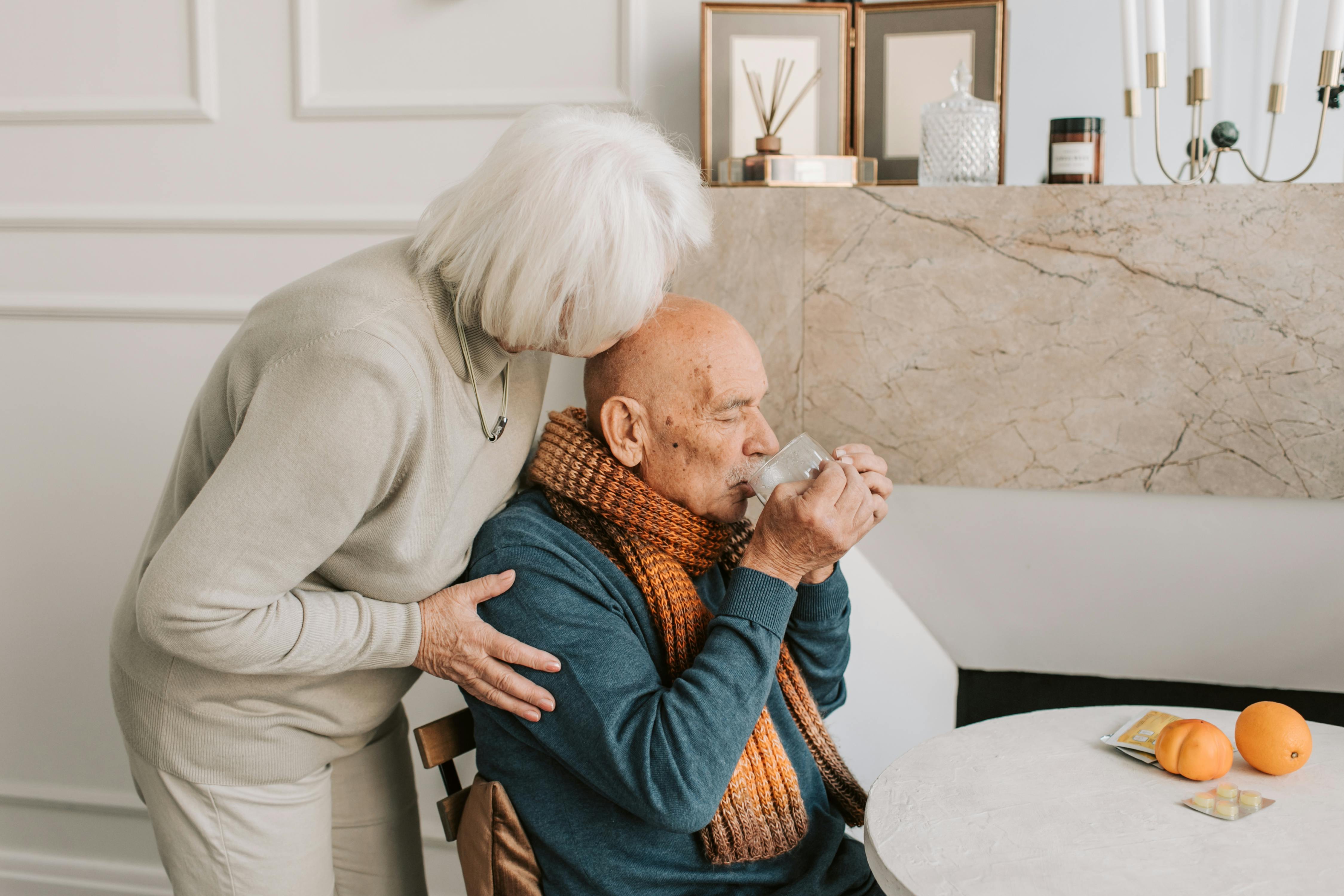 Older couple sharing a quiet supportive moment at home